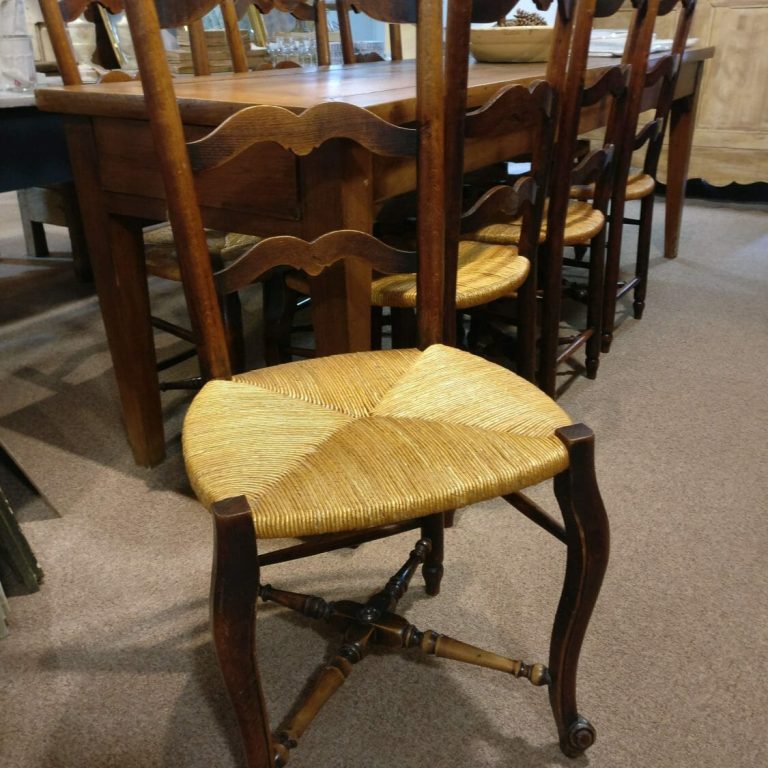 Eight Provencal rush seated chairs