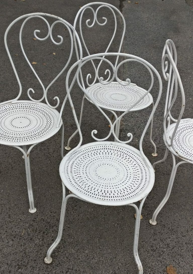 Four white painted French metal chairs