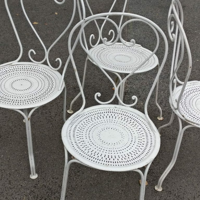 Four white painted French metal chairs