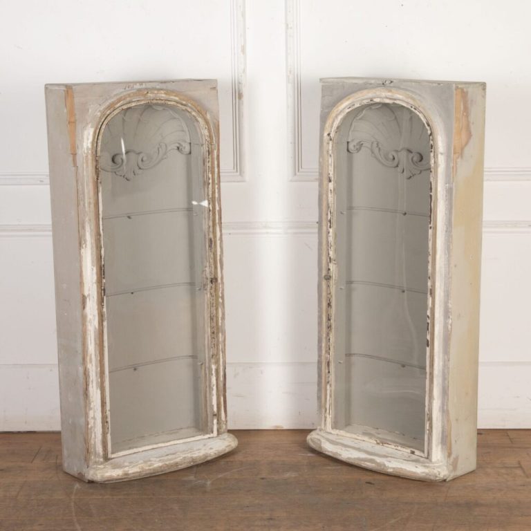 Pair of tall concave display cabinets